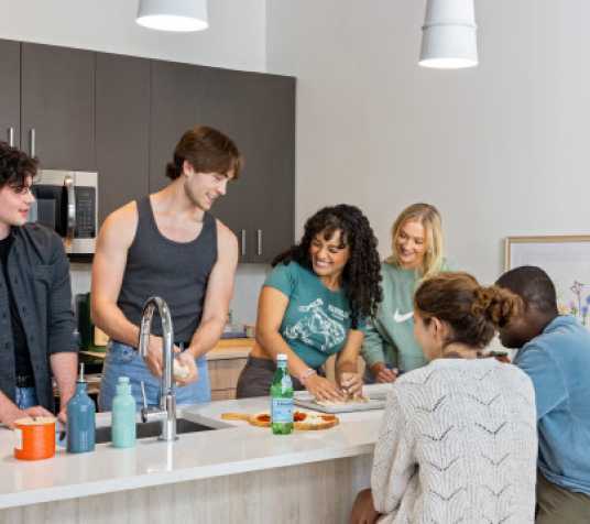 Friends cooking together in a kitchen