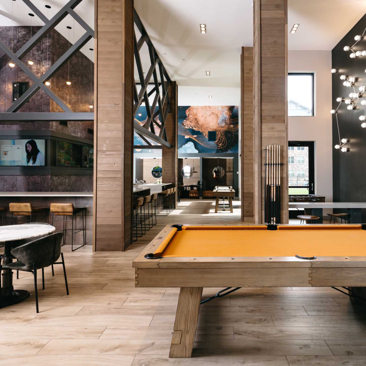 A lounge with a pool table